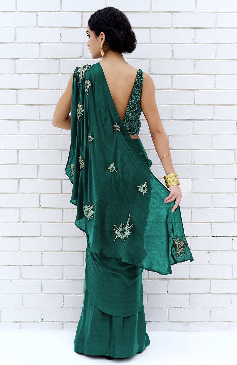 Emerald green saree with starburst bead and sequin embroidery, paired with a matching blouse.