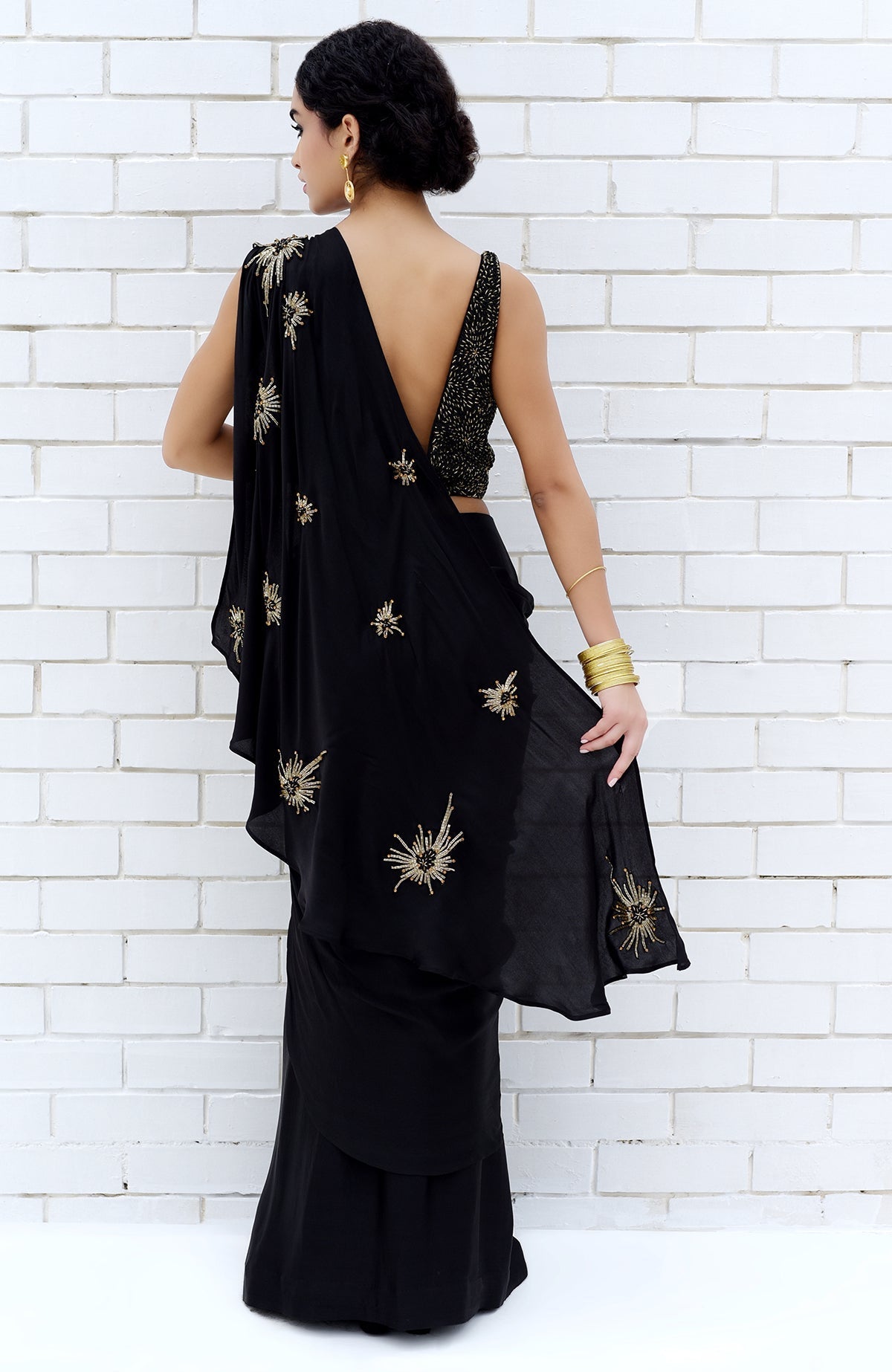 Black starburst beads and sequin hand-embroidered saree with a matching blouse.