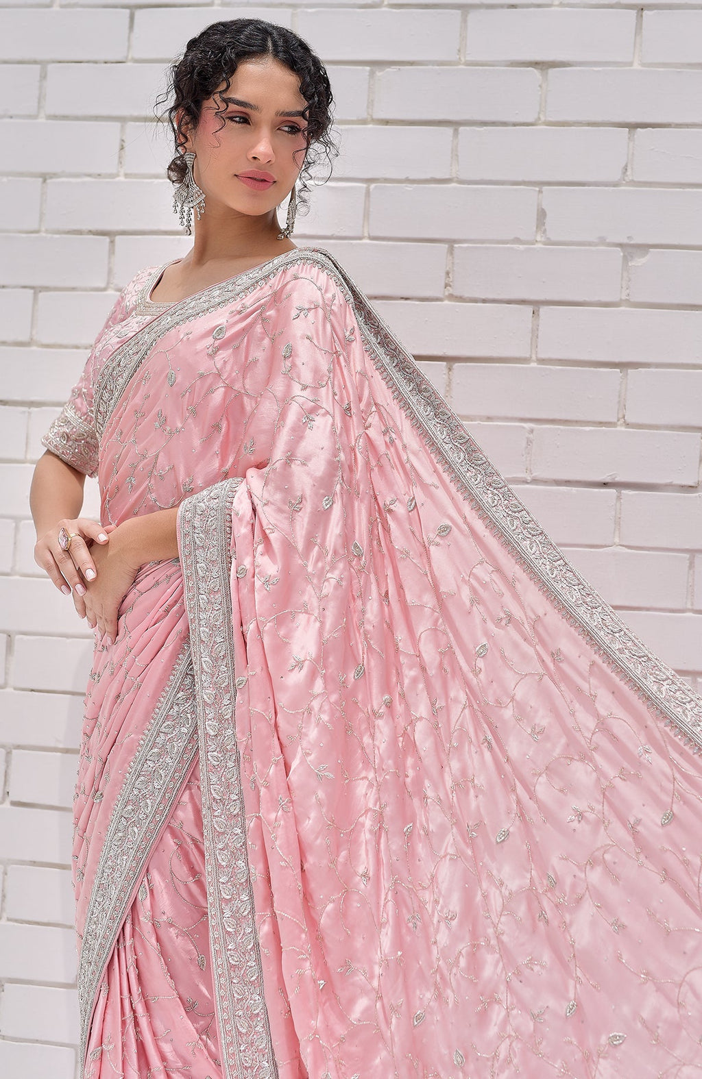 Pink pure silk saree with silver zardozi embroidery and a matching blouse.