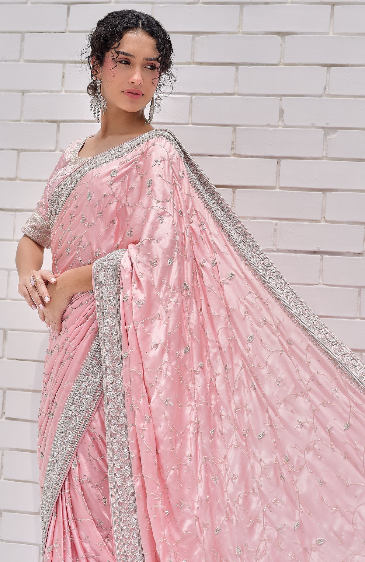 Pink pure silk saree with silver zardozi embroidery and a matching blouse.