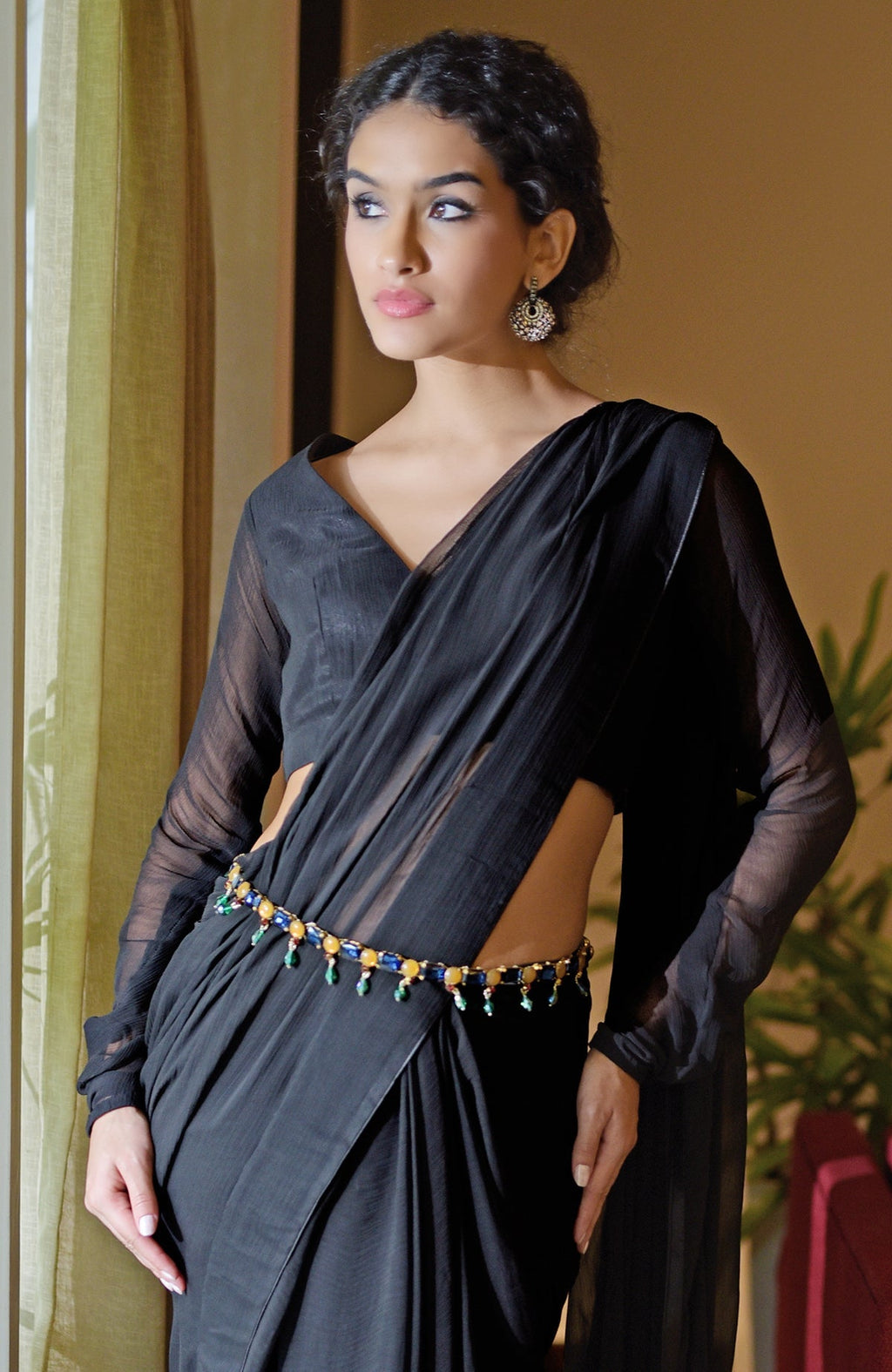 Black chiffon saree with a blue jeweled crystal belt.