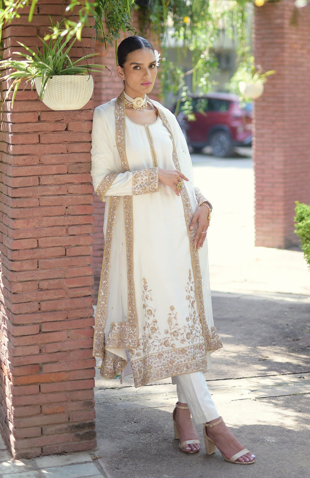 Ivory-gold marori beads and sequin hand embroidered kurta set.