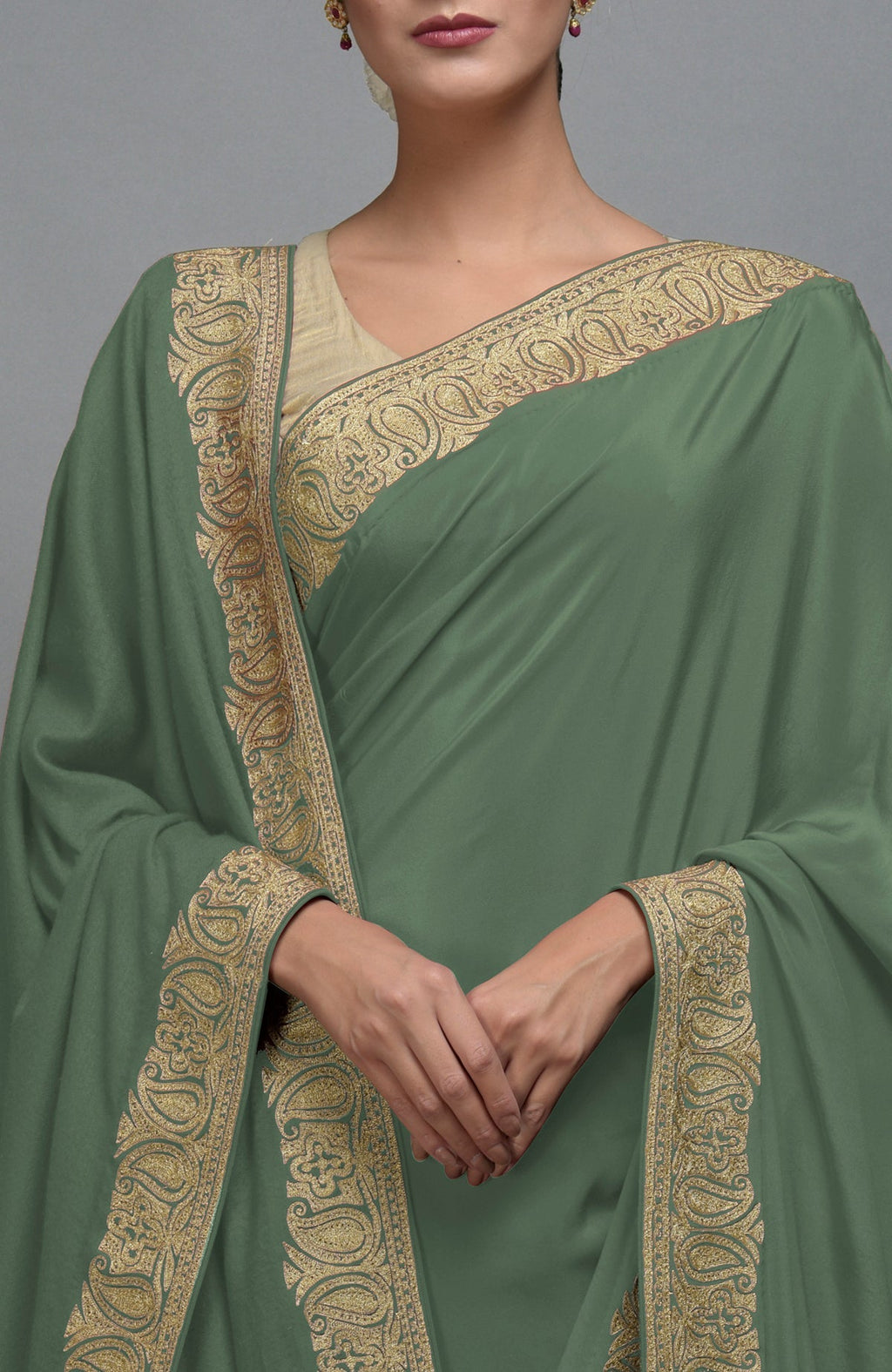 Dark jade saree with gold paisley Kashmiri tilla aari embroidered borders.