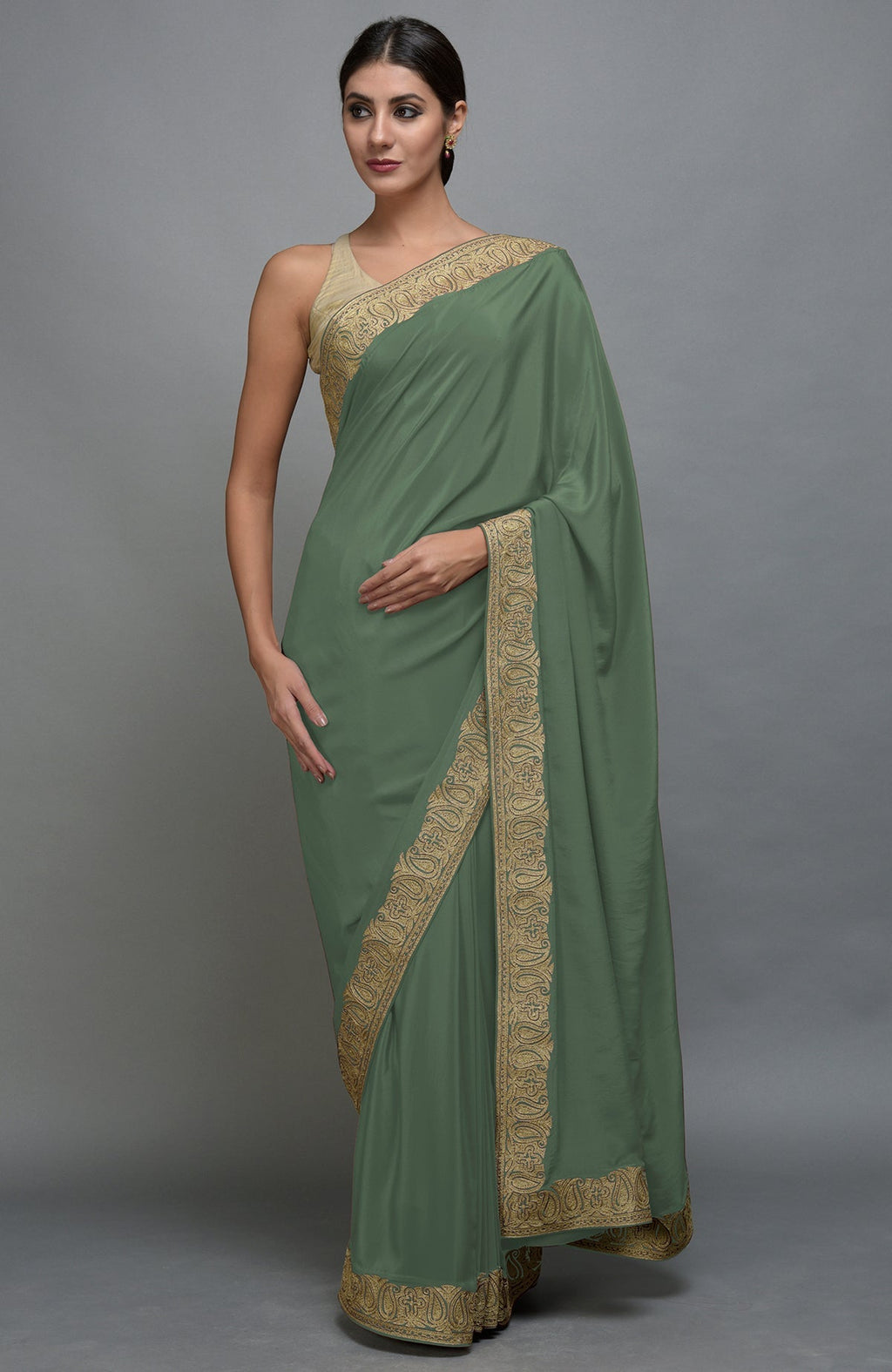 Dark jade saree with gold paisley Kashmiri tilla aari embroidered borders.