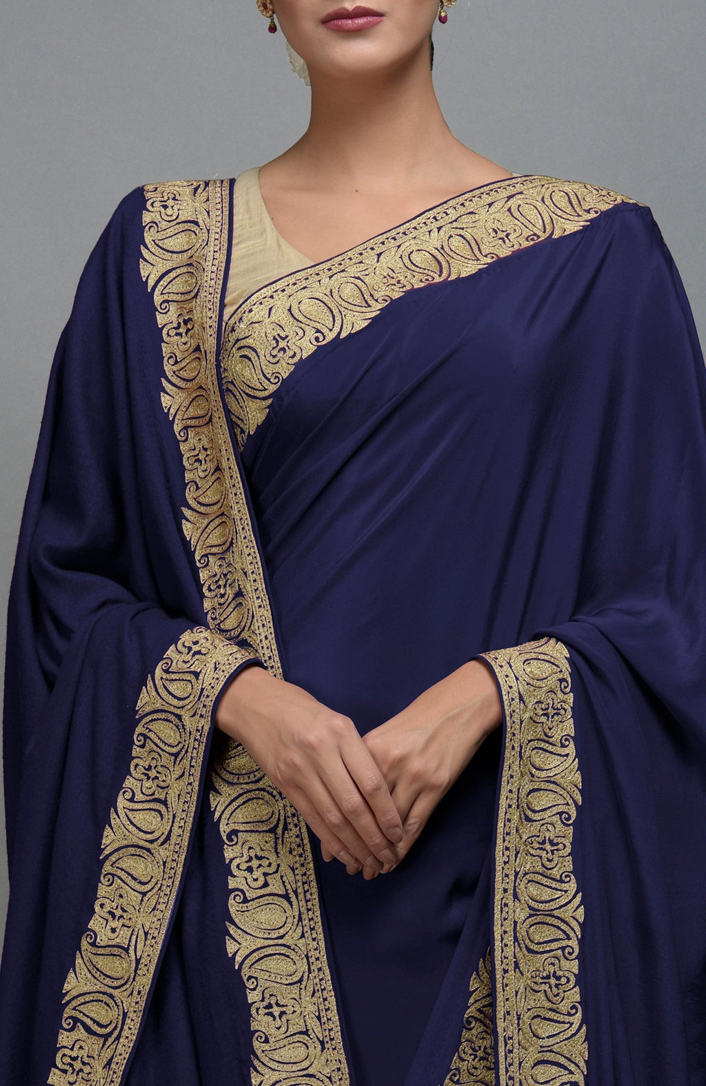 Navy blue saree with gold paisley embroidery and a matching shawl.