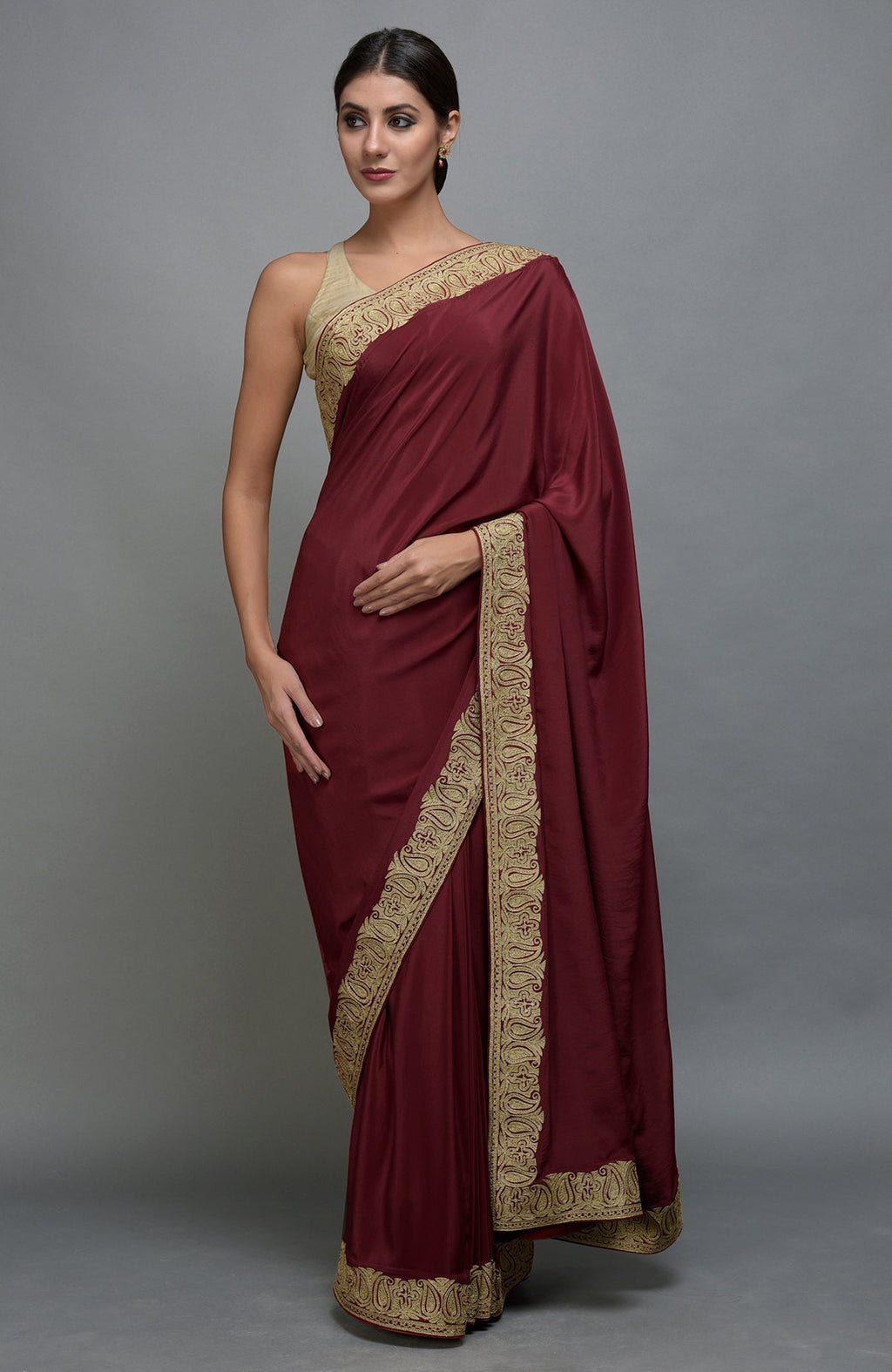 Maroon Kashmiri Tilla Aari embroidered saree with paisley borders.