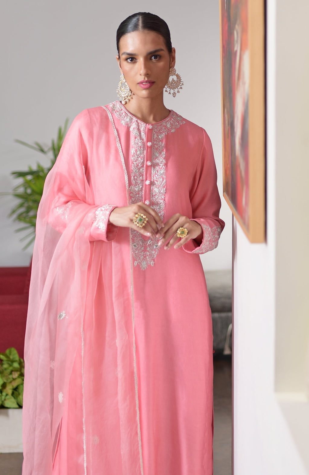 Flamingo pink chikankari suit set with white embroidery and sequin details.
