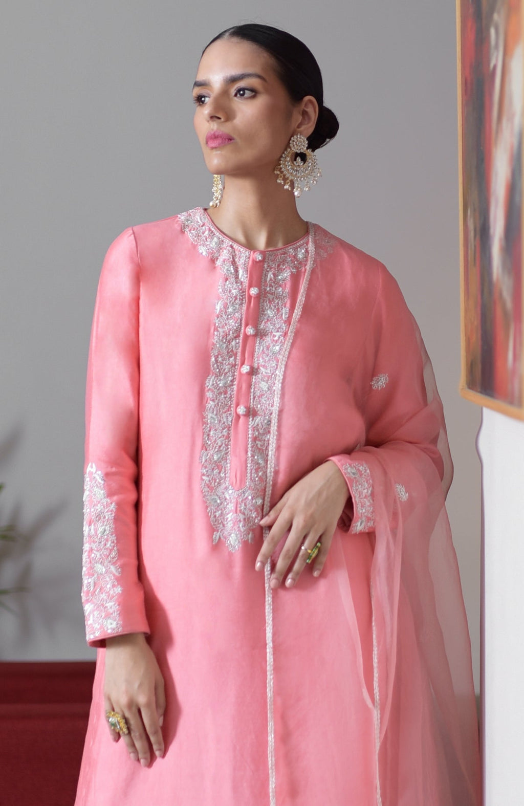 Flamingo pink hand-embroidered chikankari suit set with a matching dupatta.