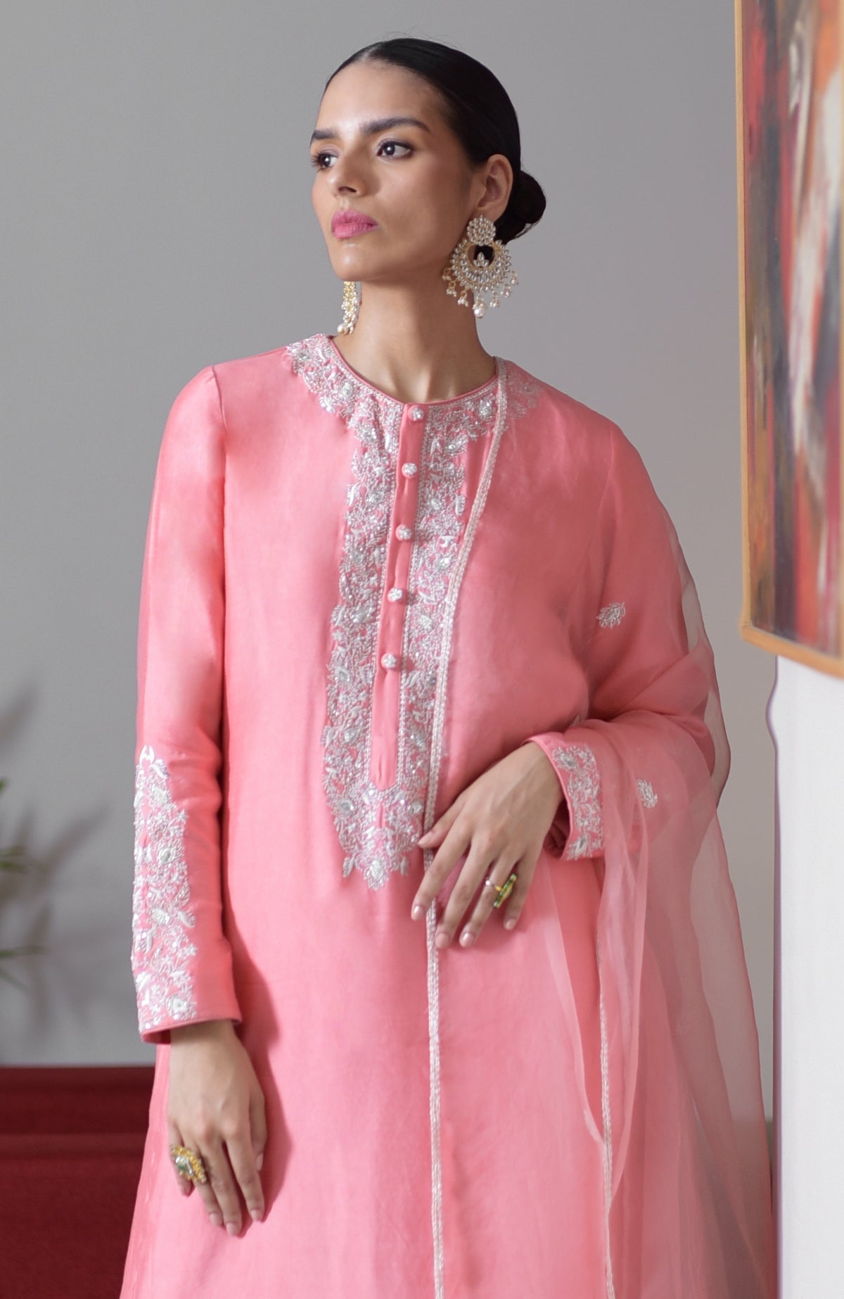 Flamingo pink hand-embroidered chikankari suit set with a matching dupatta.
