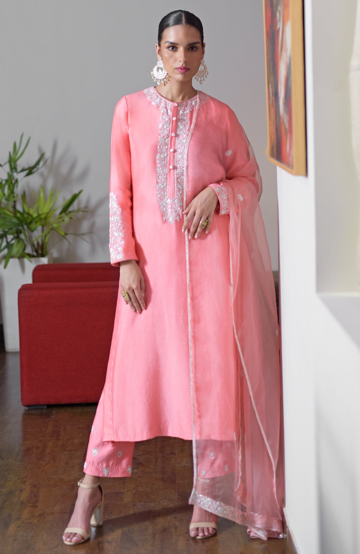 Flamingo pink hand-embroidered chikankari suit set with sequin details and organza dupatta.