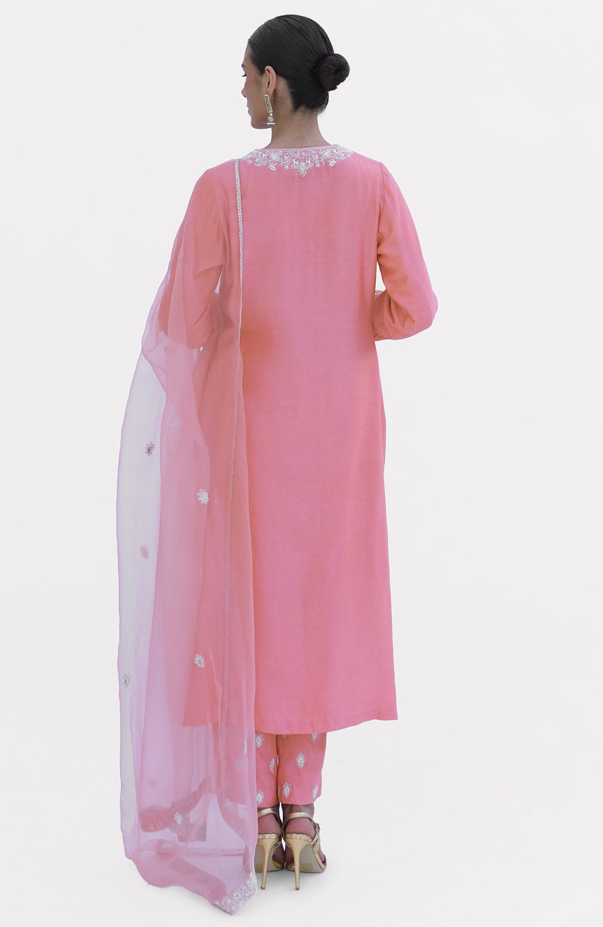 Flamingo pink chikankari suit set with a sheer dupatta, viewed from the back.