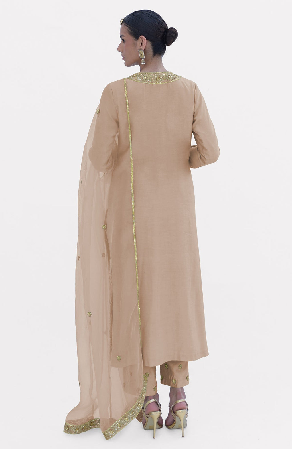 Beige kurta set with gold embroidery, dupatta, and pants.
