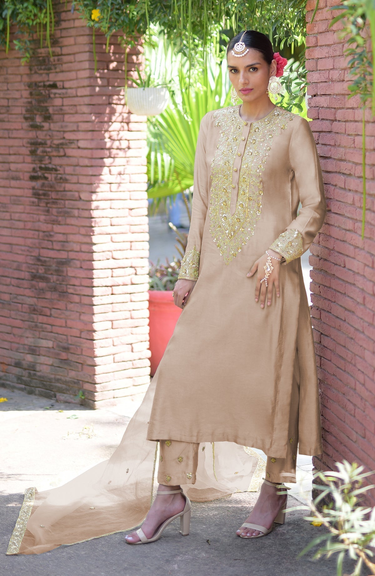 Beige kurta set with gold marori beads and sequin embroidery.