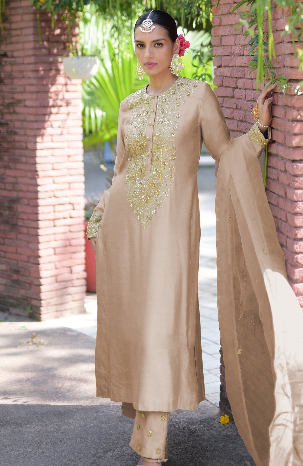 Beige kurta set with gold marori beads and sequin embroidery.