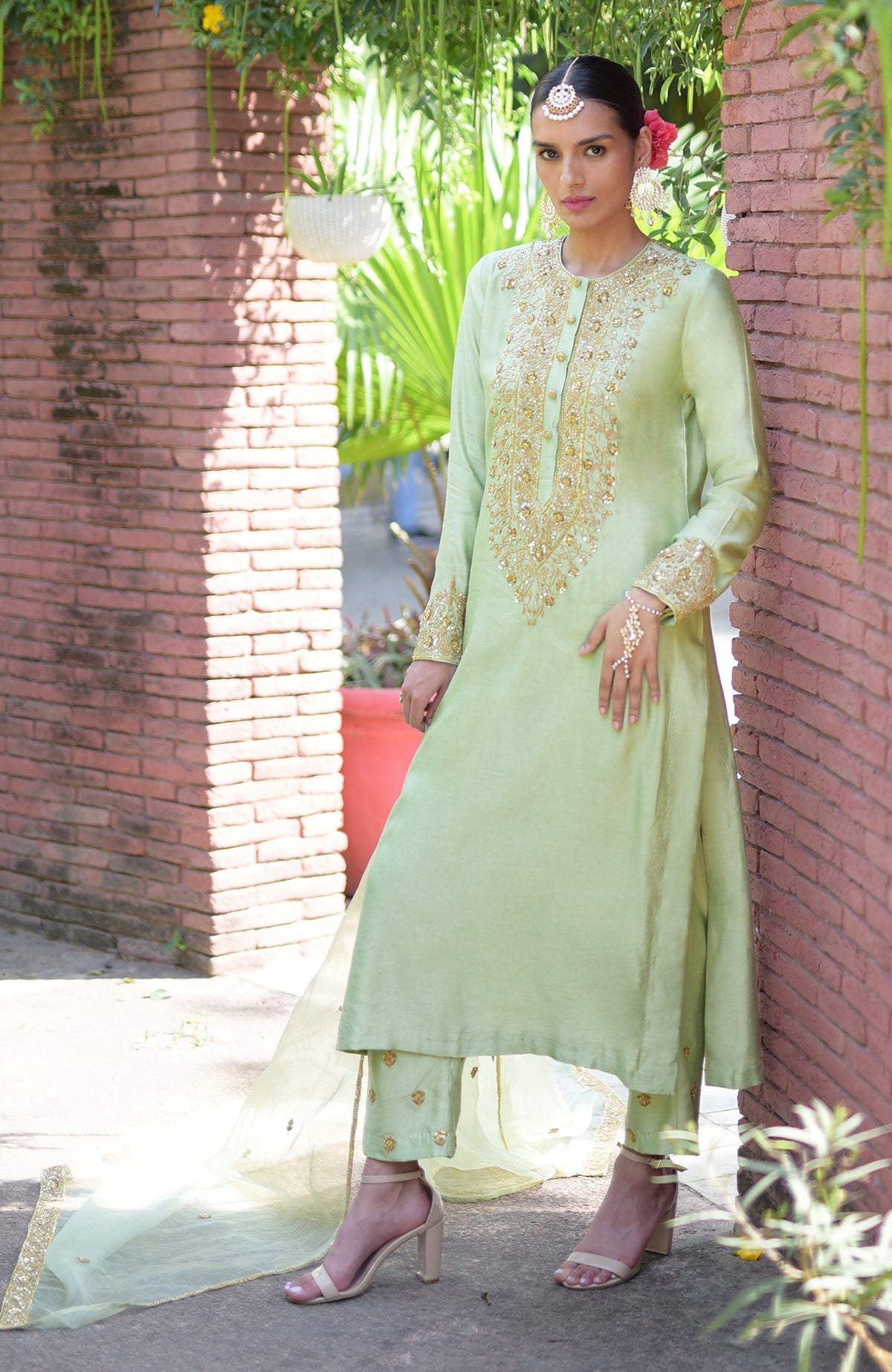 Pista green kurta set with gold marori beads and sequin embroidery.
