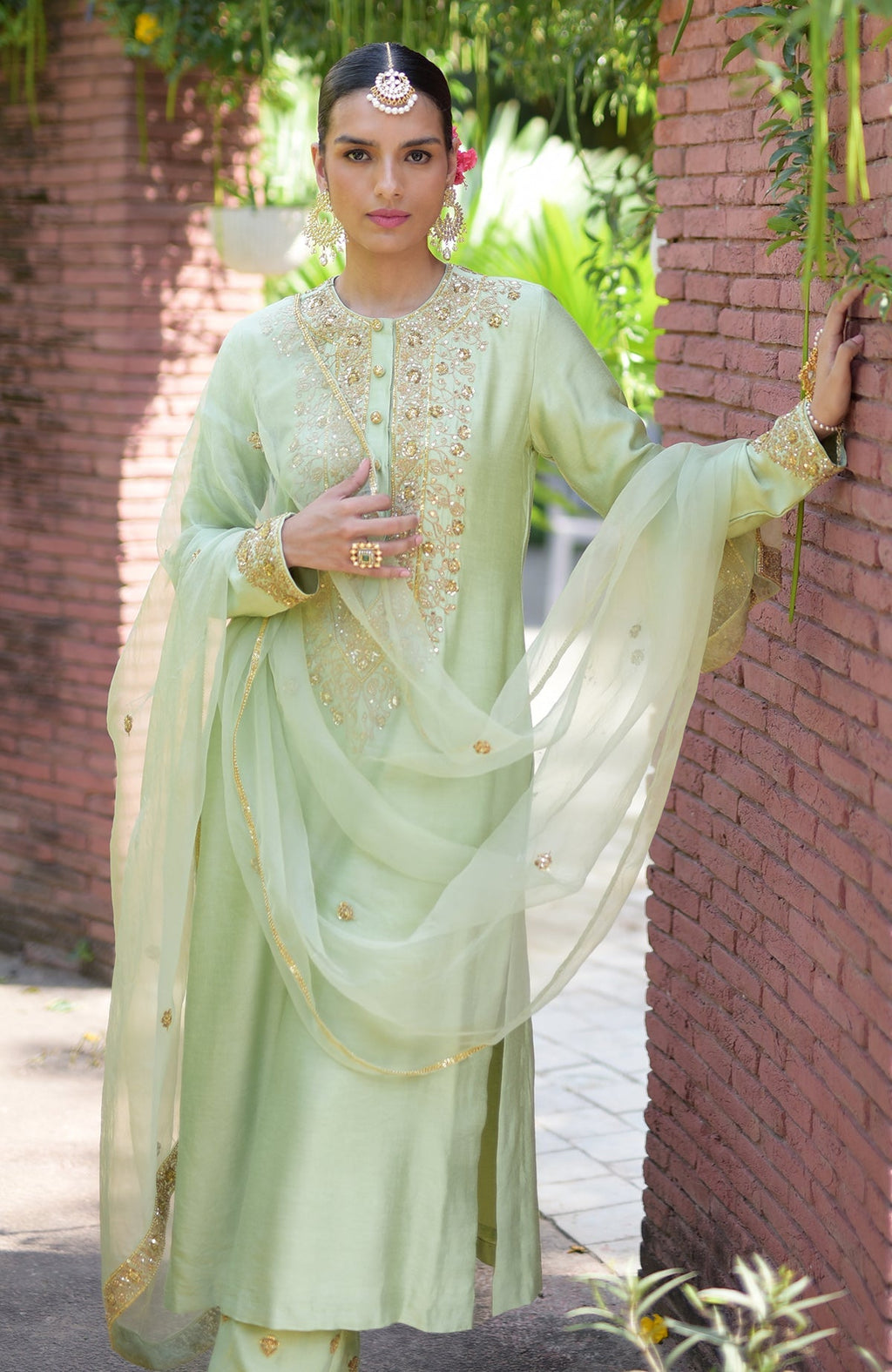 Pista green kurta set with gold marori beads and sequin embroidery.
