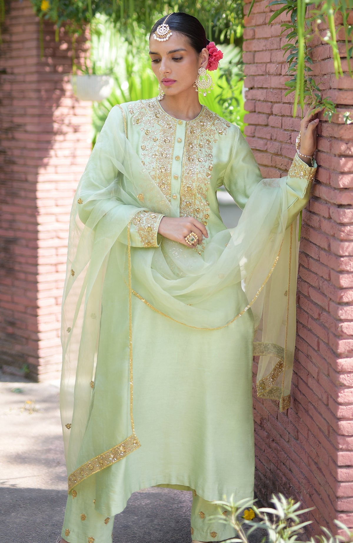 Pista green kurta set with gold marori beads and sequin embroidery.