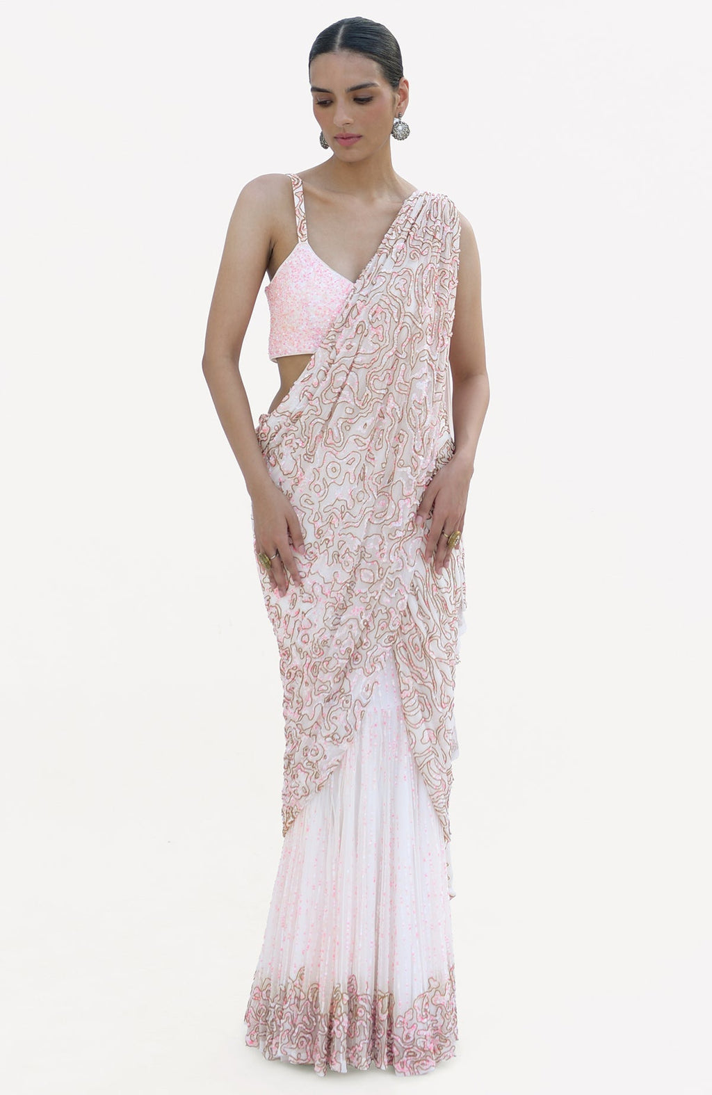 White and pink hand-embroidered draped saree set with a sequined blouse.
