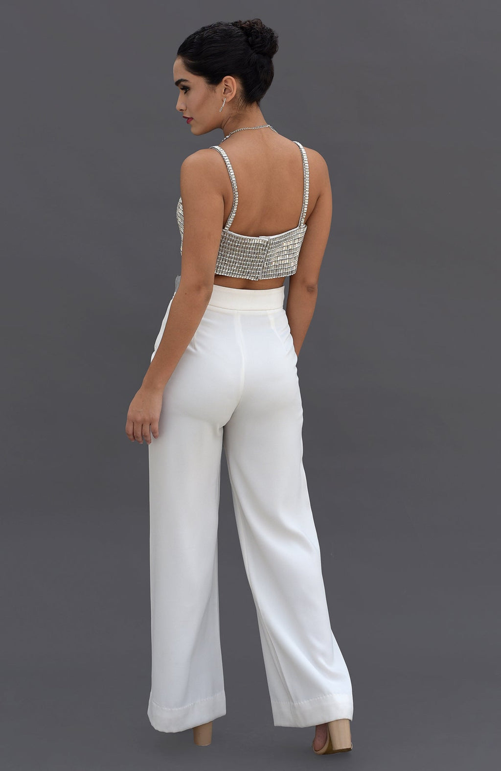 Diamante crystal hand-embroidered bustier and white pants set, viewed from the back.