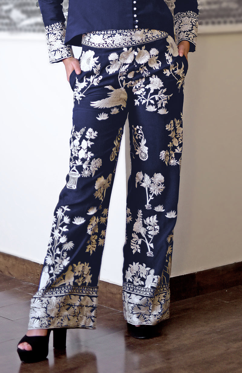 Navy blue Parsi Gara embroidered co-ord set with white floral and bird motifs.