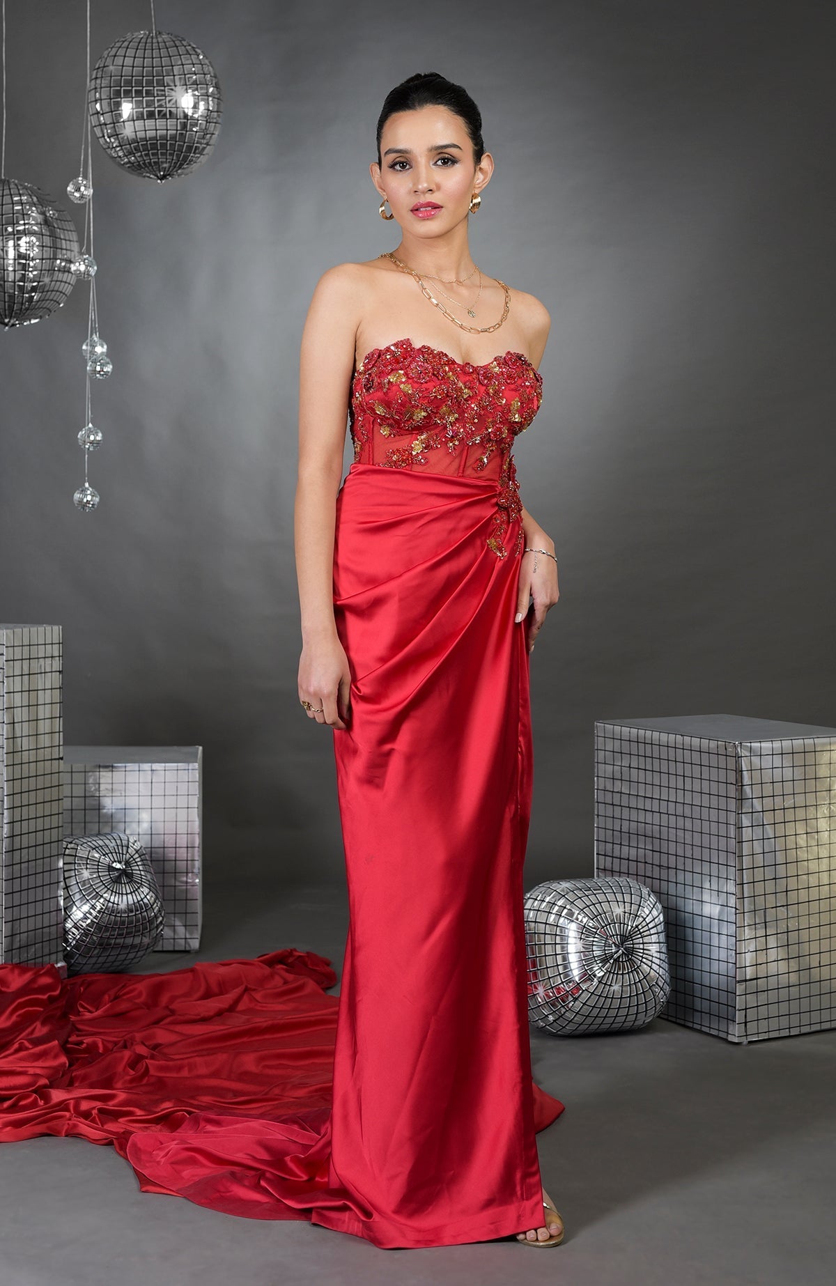 Red pure satin floral hand-embroidered gown with a sweetheart neckline.