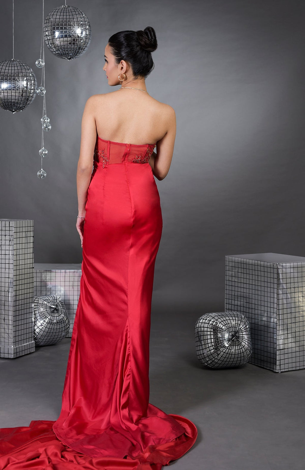 Red pure satin floral hand-embroidered strapless gown with a train.