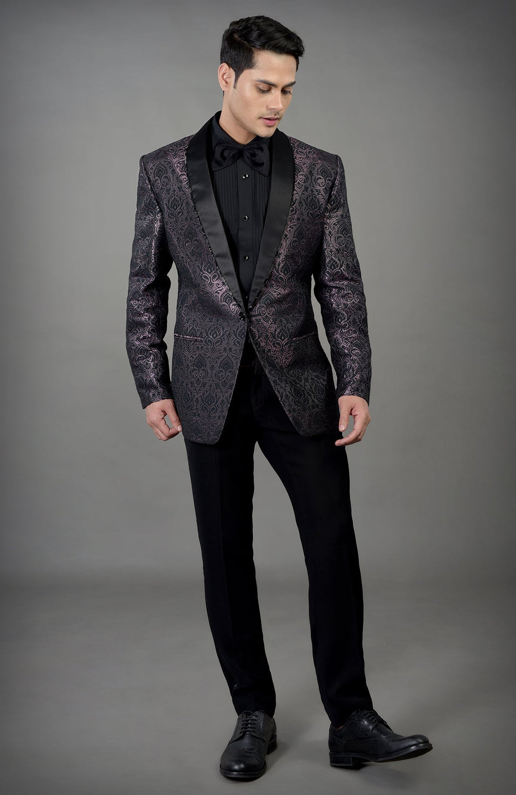 Black woven brocade tuxedo set with a satin lapel.