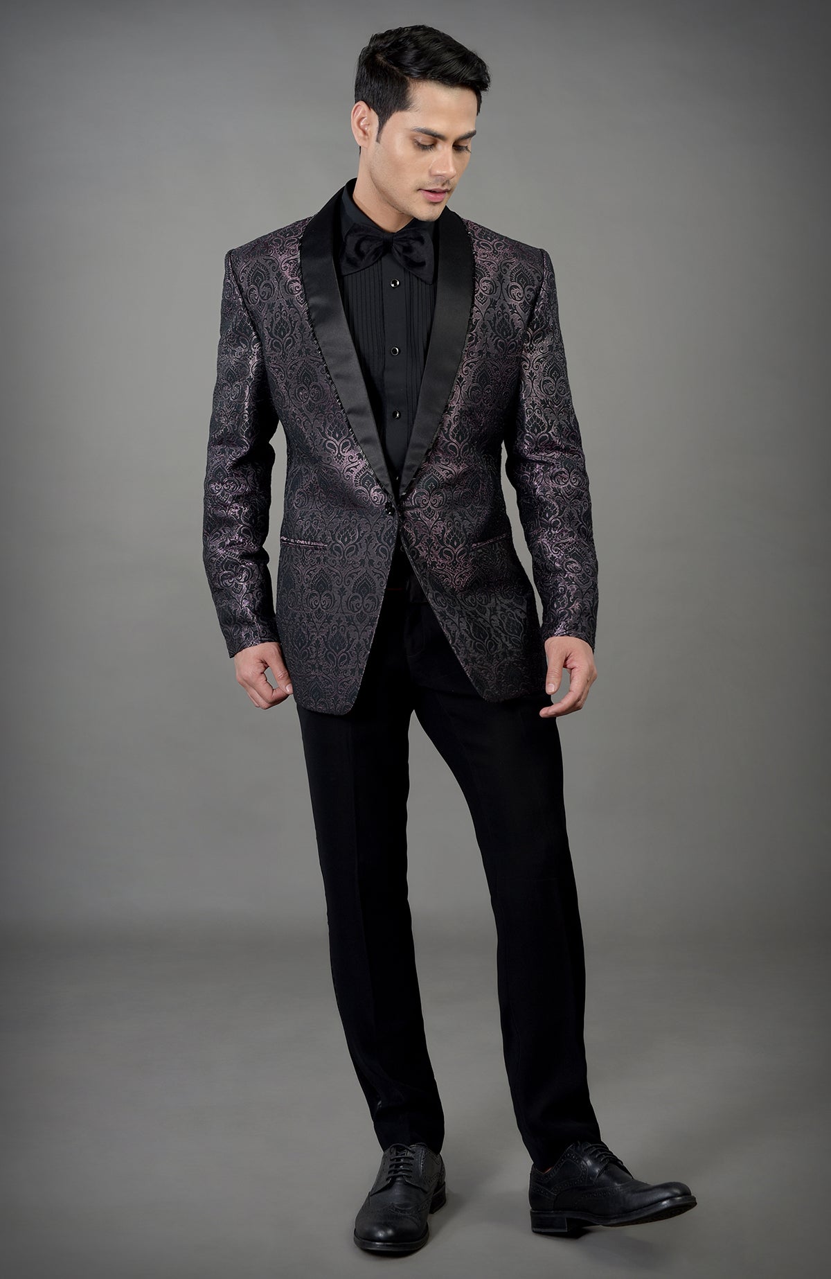 Black woven brocade tuxedo set with a satin lapel.