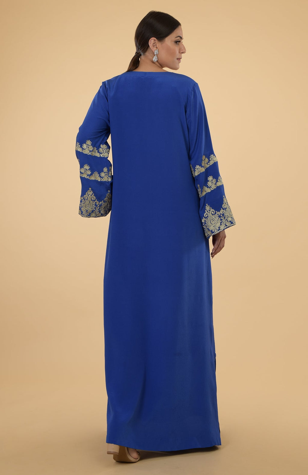 Cobalt blue kaftan with gold Kashmir embroidery on the bell sleeves.