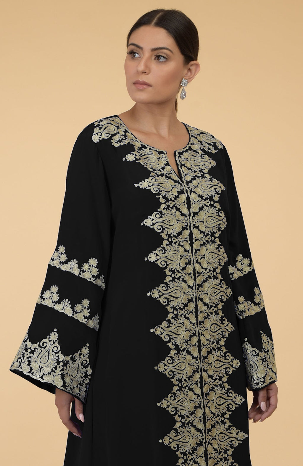 Black kaftan with gold Kashmir embroidery, featuring a round neck and bell sleeves.