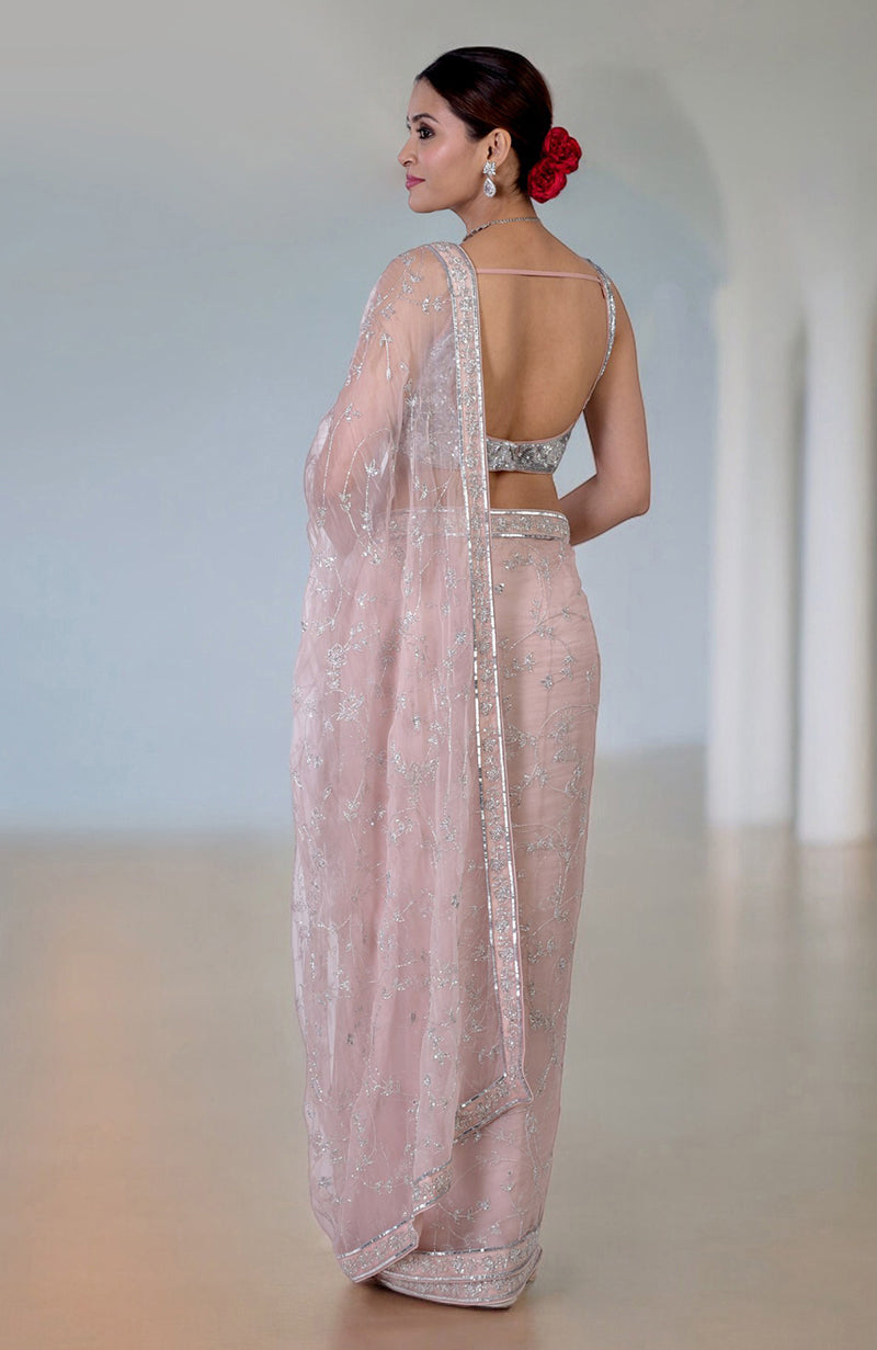 An Oyster Pink Saree with Silver Beads & Sequin Zardozi Hand Embroidery.