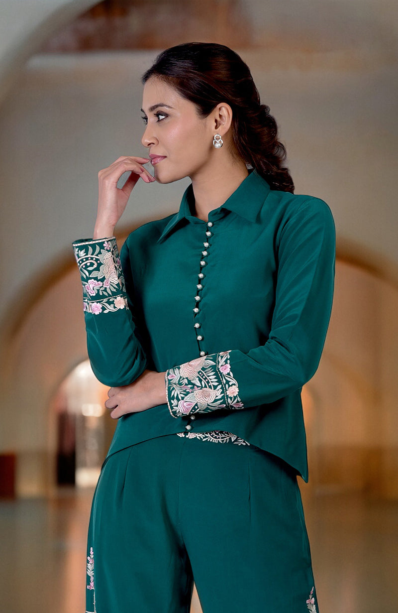 Green Parsi Gara embroidered co-ord set with a high-low shirt and matching pants.