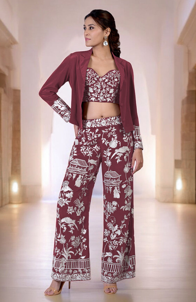 A woman models a Chianti Parsi Gara embroidered co-ord set with a jacket.