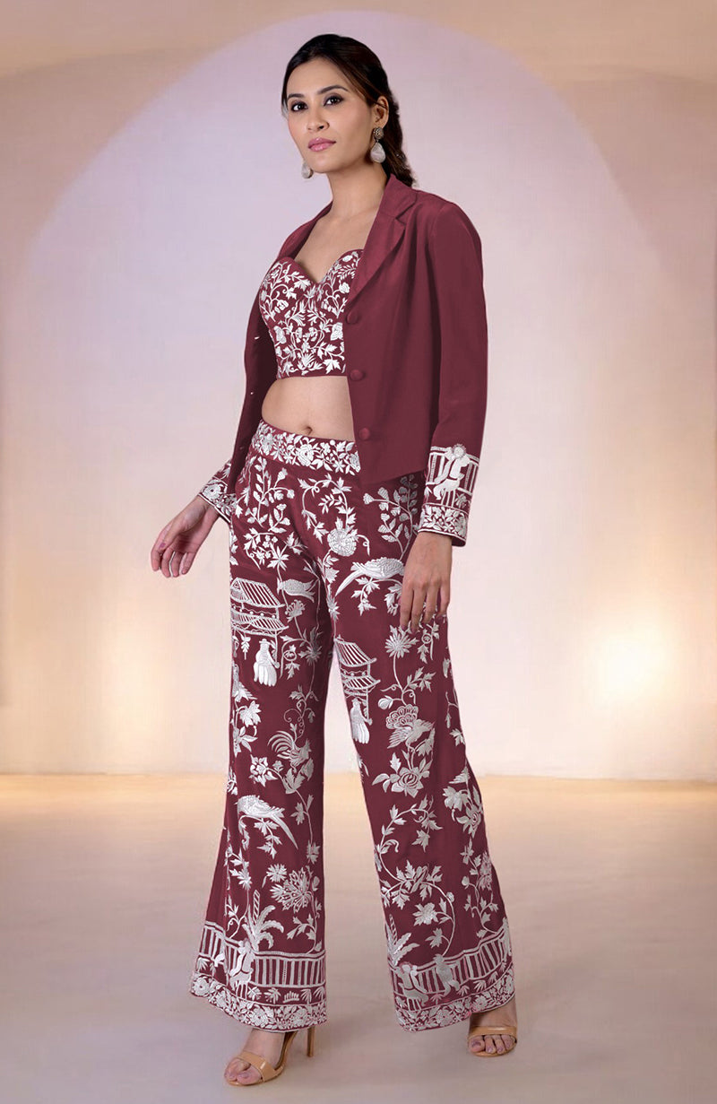 Ruby wine Parsi Gara embroidered co-ord set with a corset, pants, and jacket.