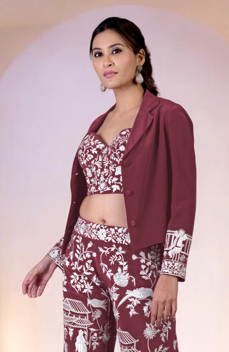 A woman models a Chianti Parsi Gara embroidered co-ord set with a jacket.