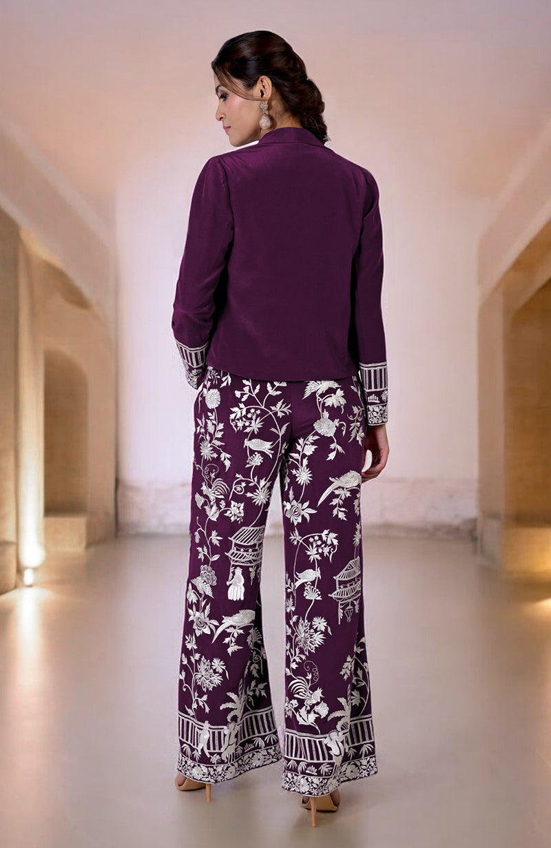 Plum Parsi Gara embroidered co-ord set with a solid jacket and patterned pants.