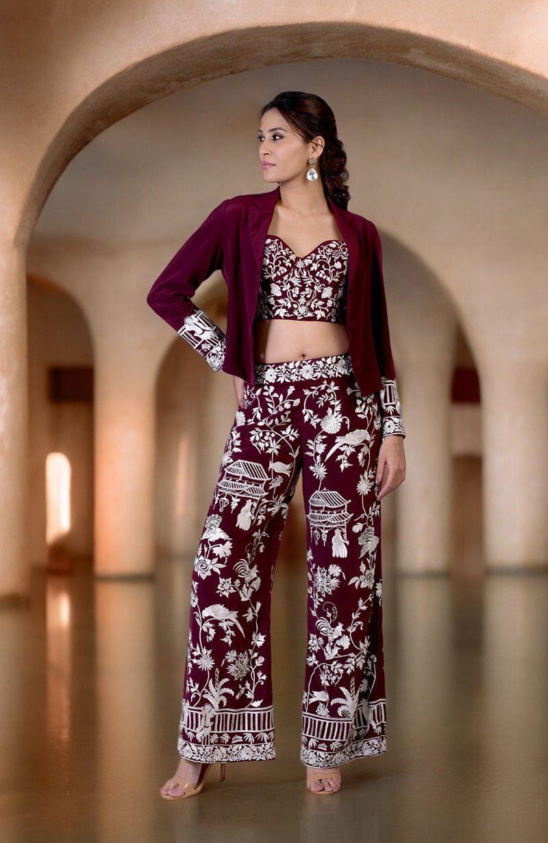 Ruby wine Parsi Gara embroidered co-ord set with a jacket, corset, and pants.