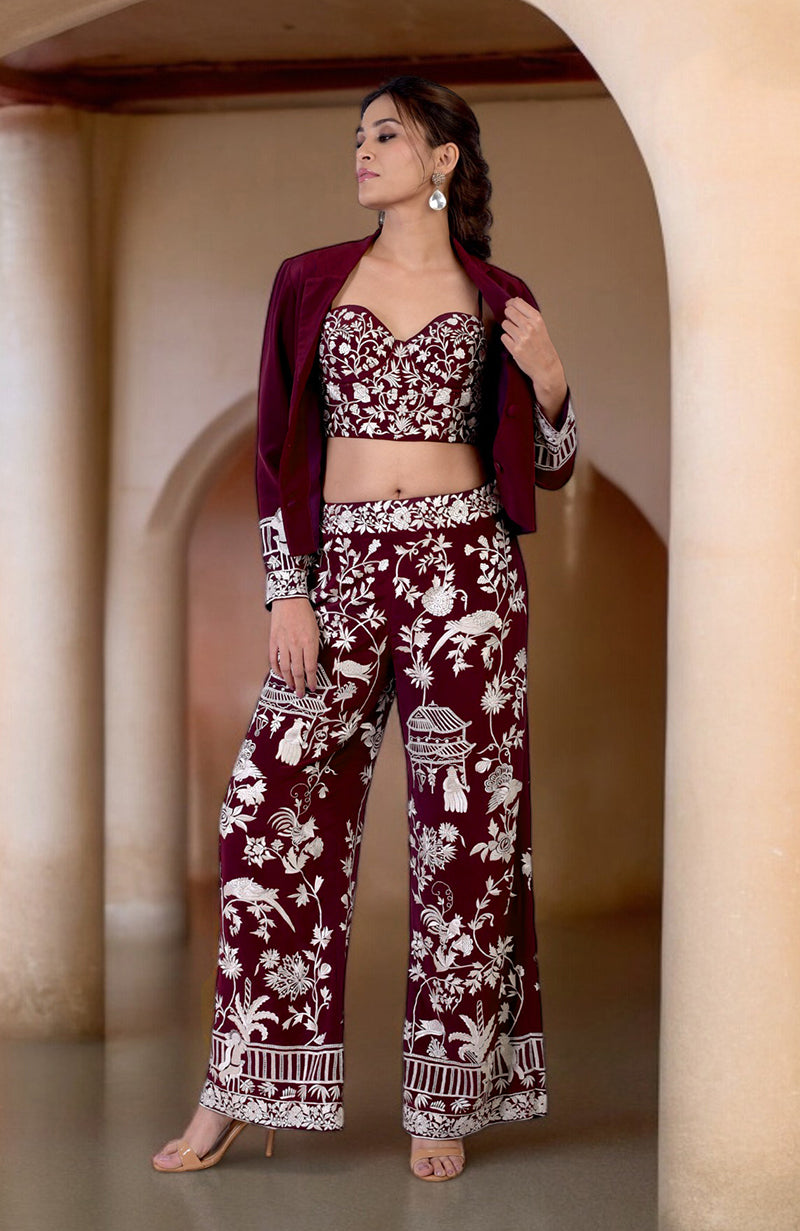 Ruby wine Parsi Gara embroidered co-ord set with corset, pants, and jacket.