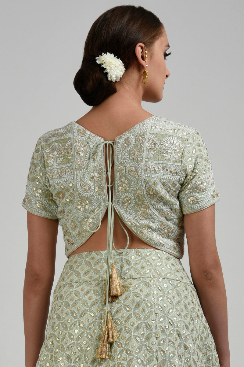 Sage green georgette blouse with intricate chikankari and rose gold gota patti embroidery