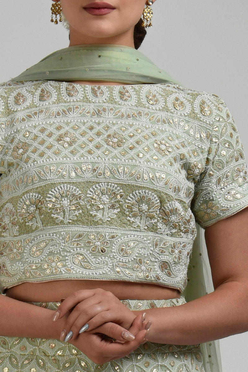 Sage green georgette blouse with intricate chikankari and rose gold gota patti embroidery