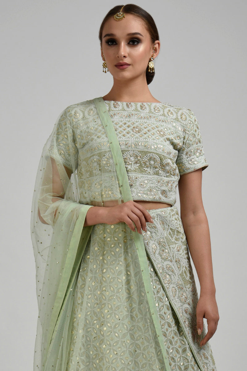 Sage green georgette blouse with intricate chikankari and rose gold gota patti embroidery