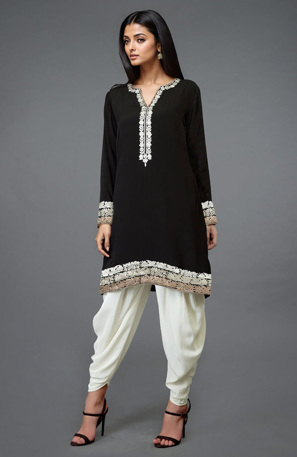 A woman models a black Parsi Gara embroidered Patiala pants suit with ivory details.