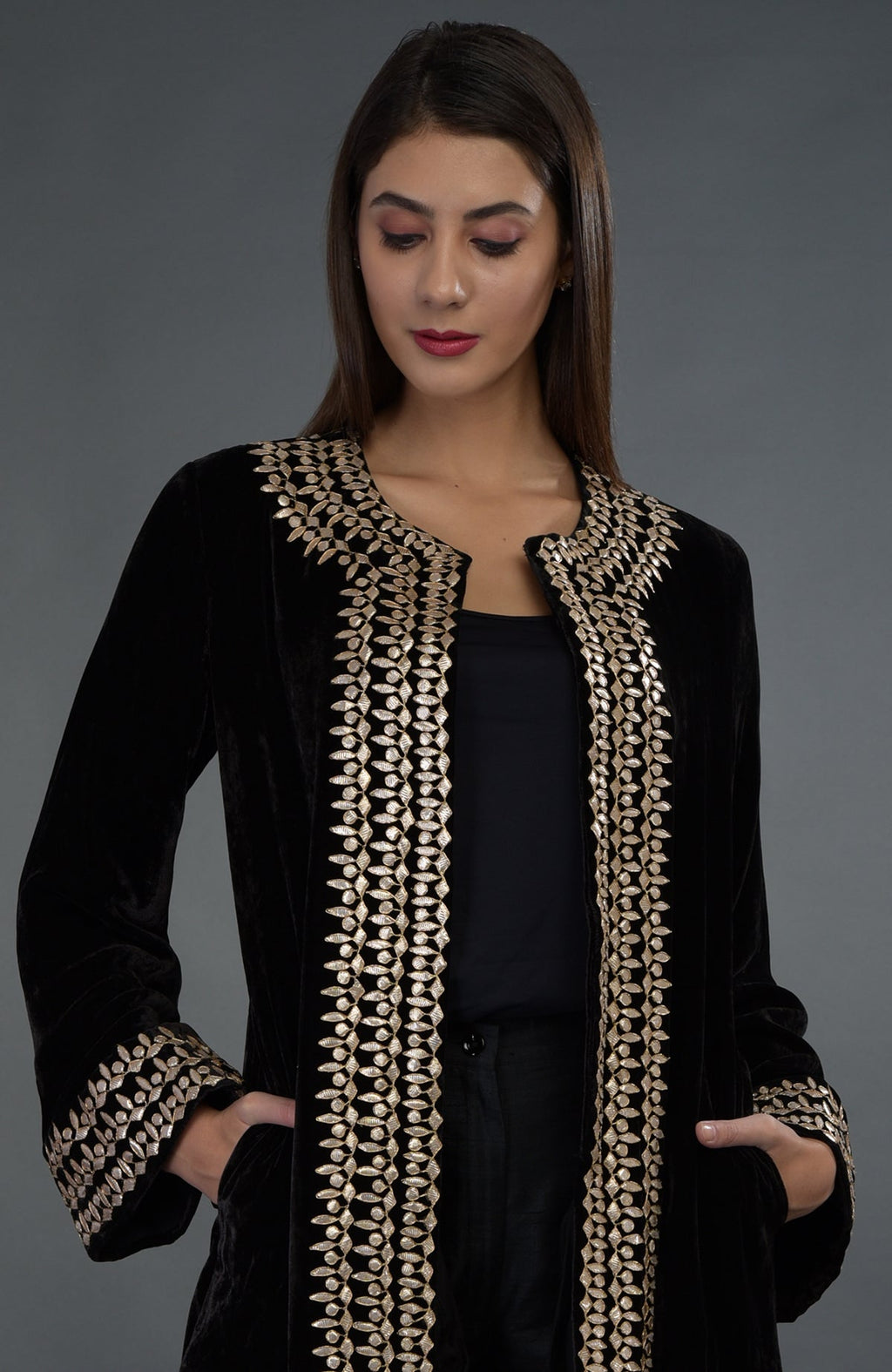 Black silk velvet jacket with rose gold gota patti hand embroidery.