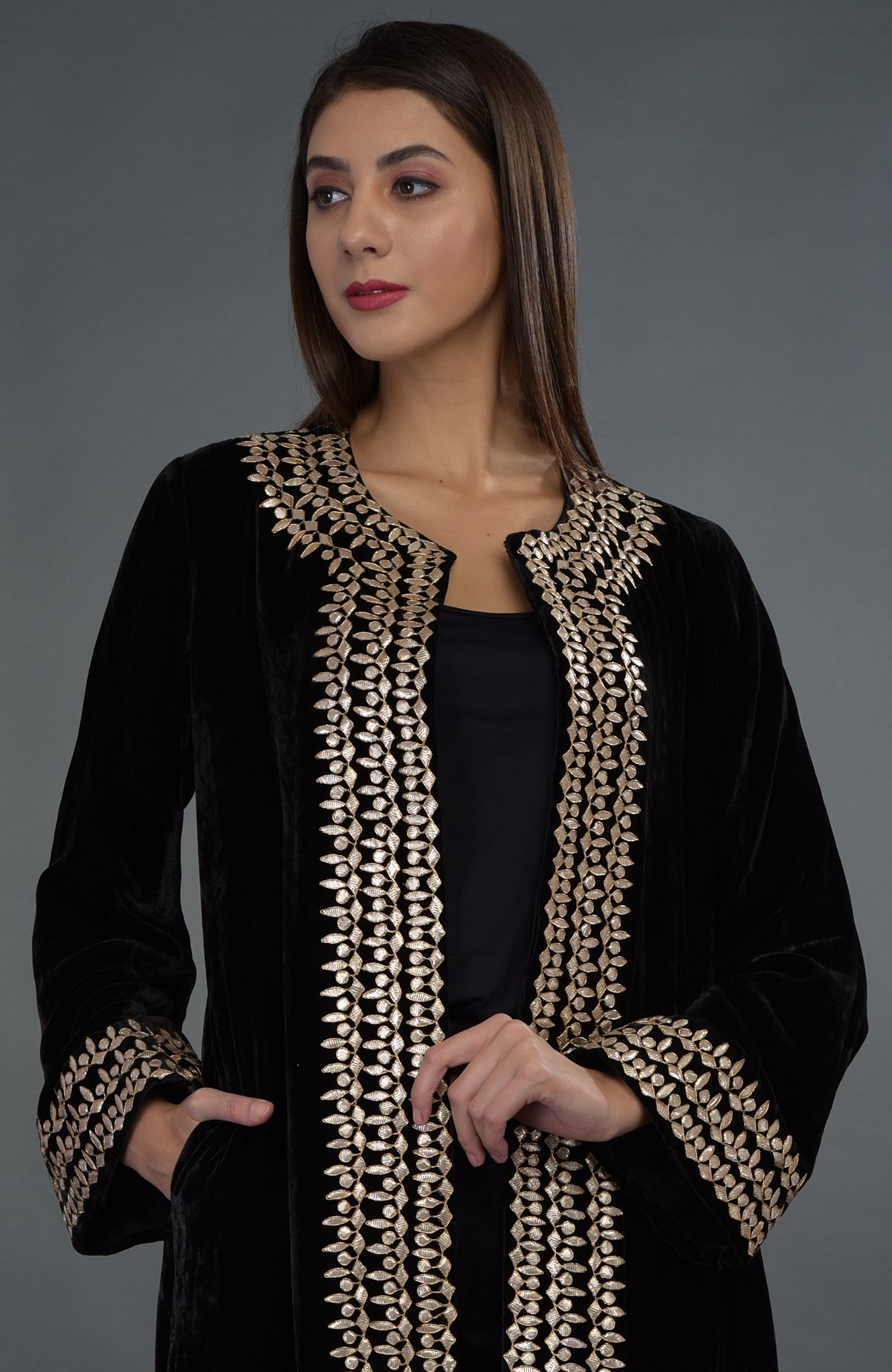 Black silk velvet jacket with rose gold gota patti hand embroidery.