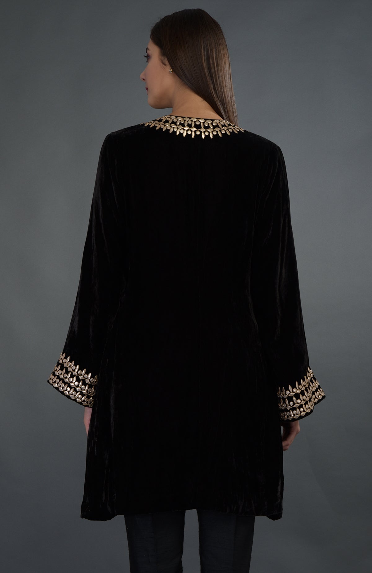 Black silk velvet jacket with rose gold gota patti embroidery on the neckline and sleeves.