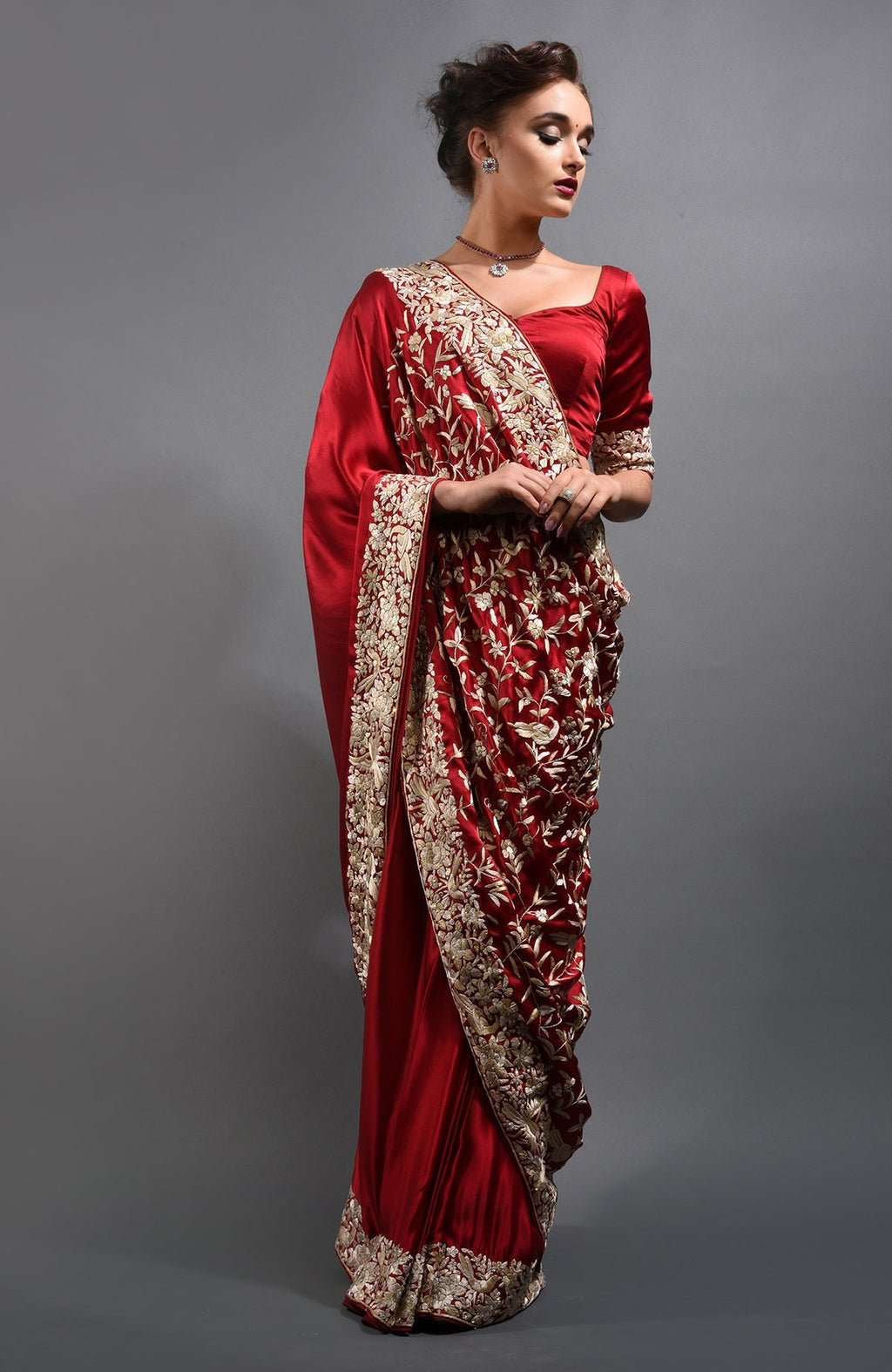 Red-beige Parsi Gara hand-embroidered saree with floral and bird motifs.