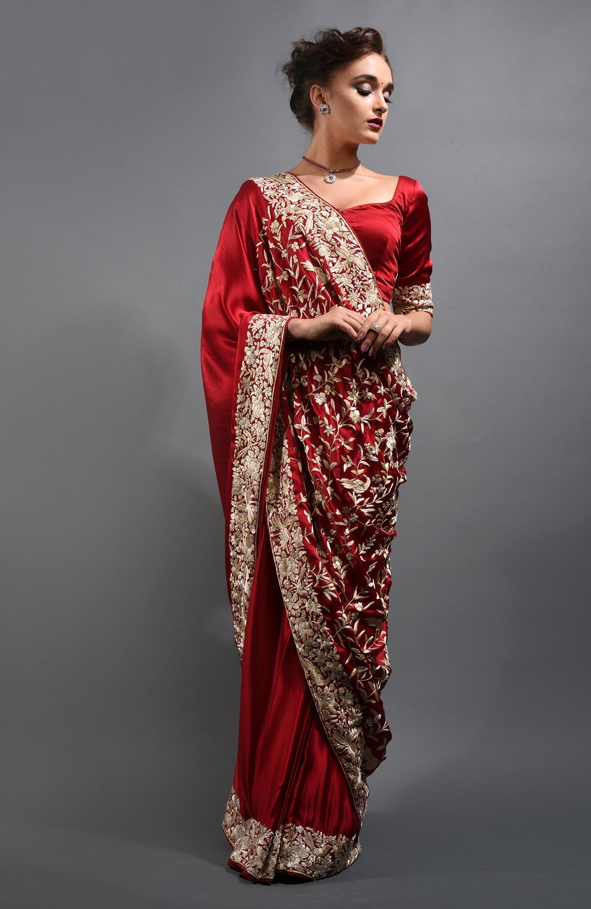 Red-beige Parsi Gara hand-embroidered saree with floral and bird motifs.