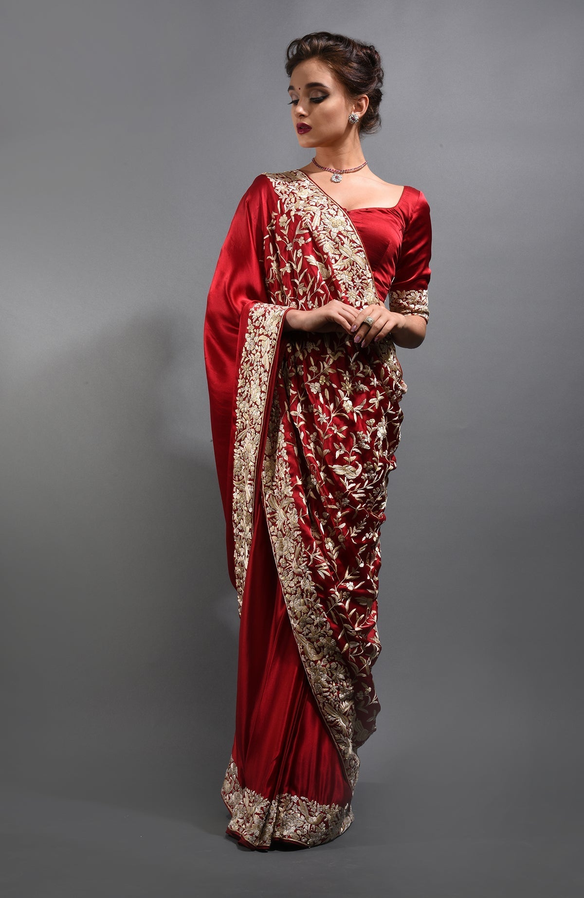 Red-beige Parsi Gara hand-embroidered saree with floral and bird motifs.