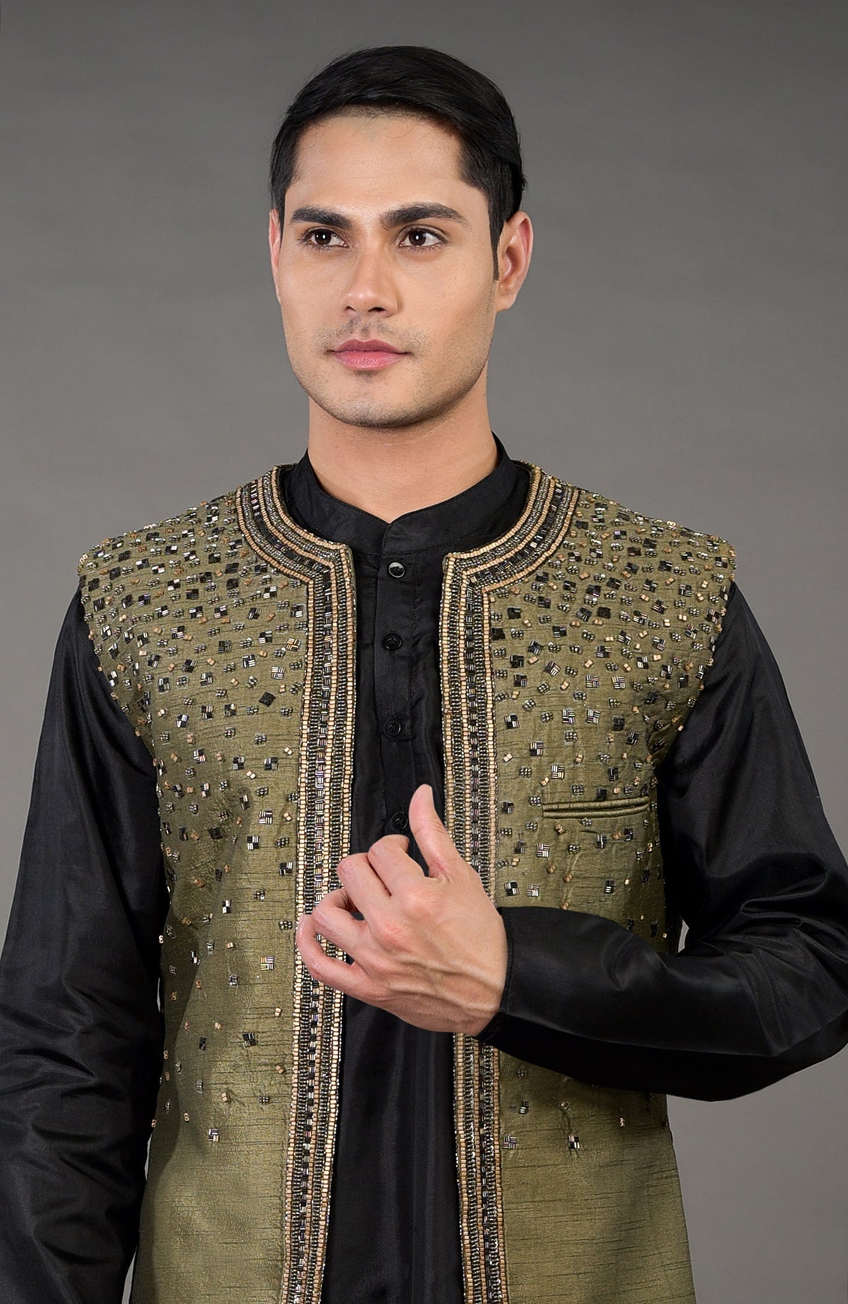 Olive hand-embroidered abstract jacket set with a black kurta.