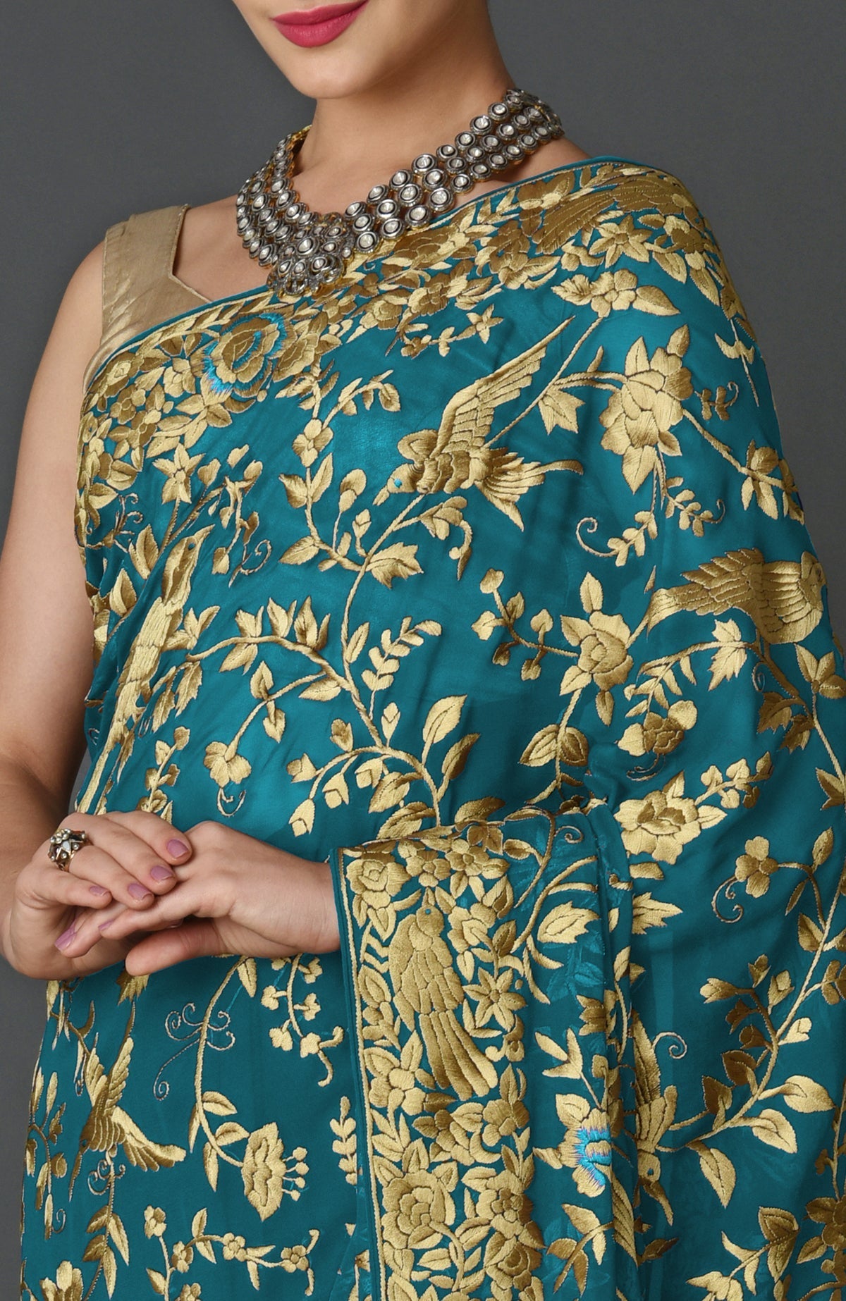 Teal blue Parsi Gara saree with beige bird and floral embroidery on georgette fabric